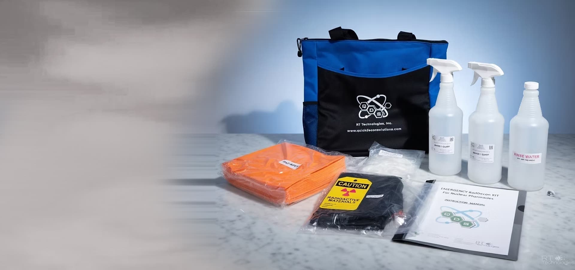 QDS decontamination kit with carry bag, spray bottles and protective clothing
